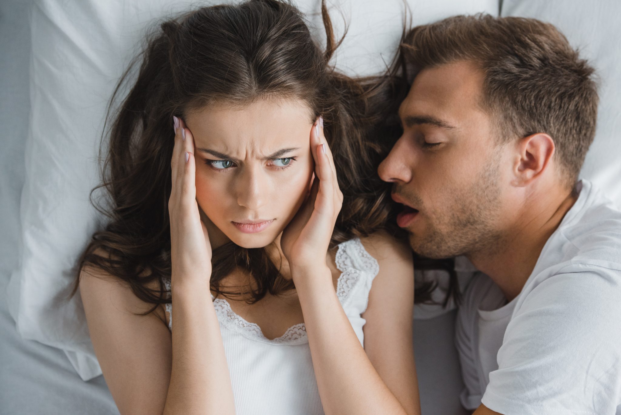 Woman Annoyed with Snoring